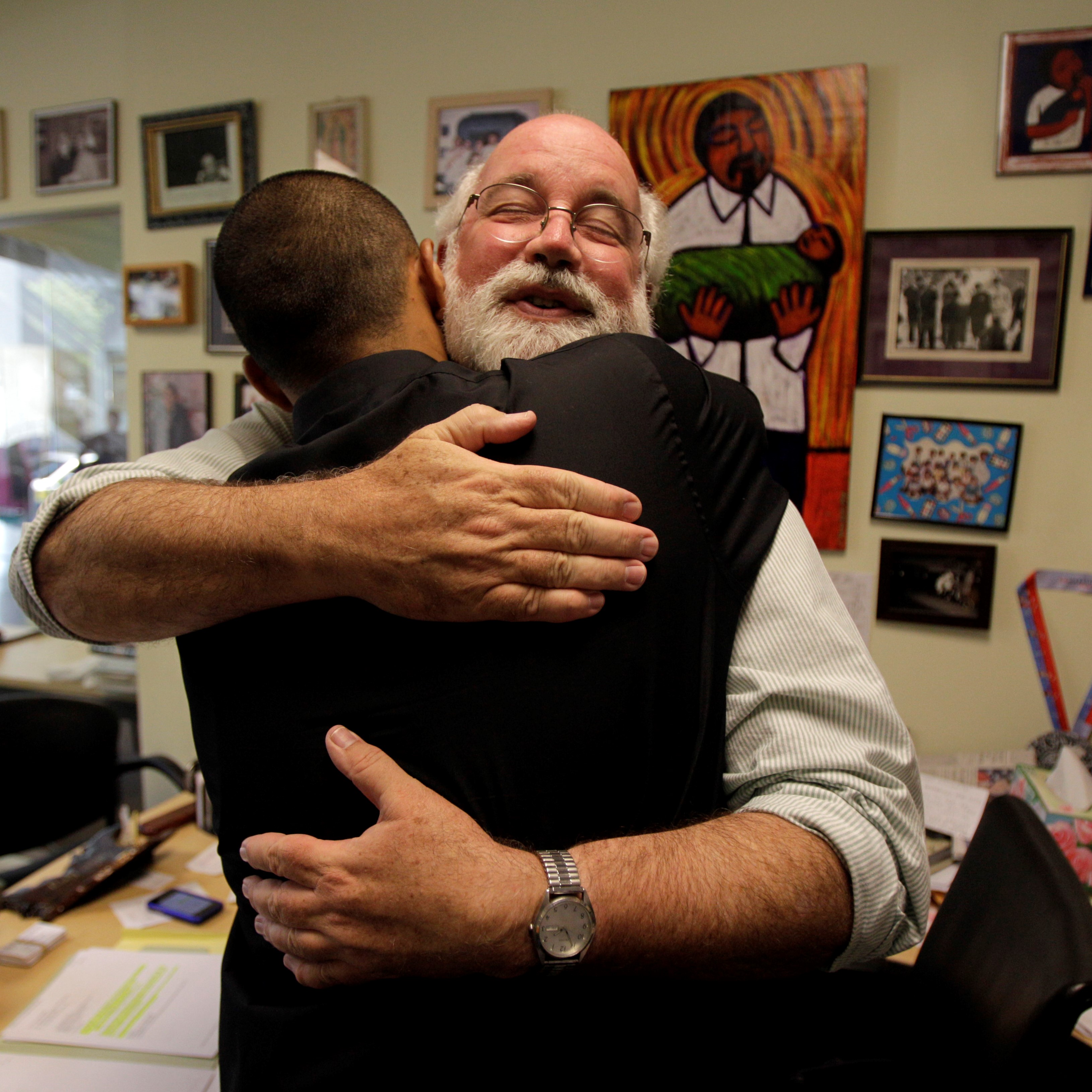 Gregory Boyle hugging person